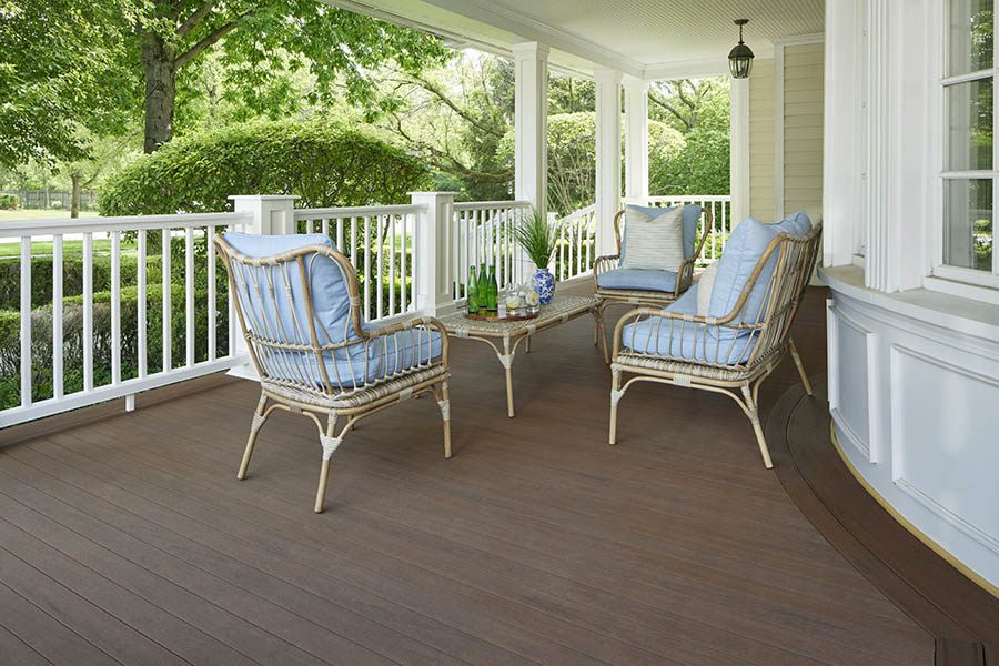 Traditional-style front porch designs feature classically inspired porch furniture