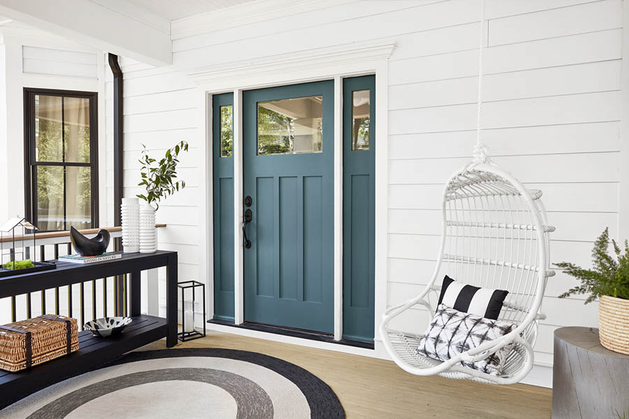 Scandinavian-inspired front porch designs feature a black and white color scheme