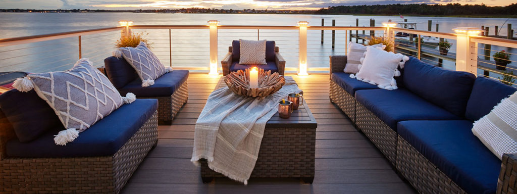 Outdoor deck lighting by TimberTech on a coastal deck enhances the design