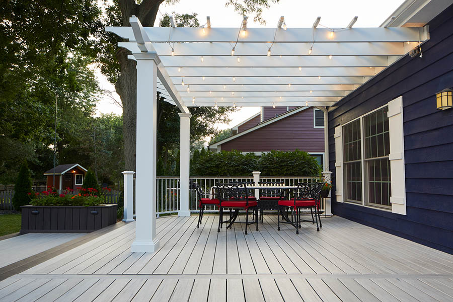 Outdoor deck lighting ideas include string lights hung around your pergola