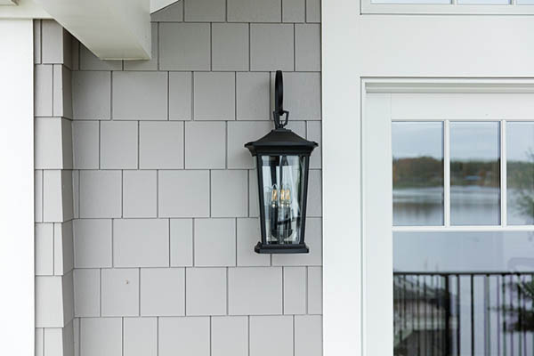 An ornate iron lantern adds artisanal details to a craftsman home
