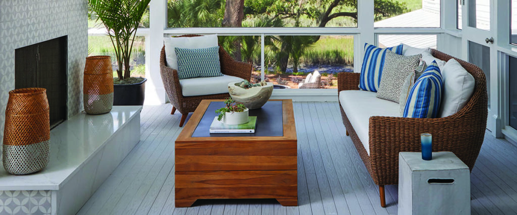 A porch remodel for a coastal home includes whites, blues, and natural textures