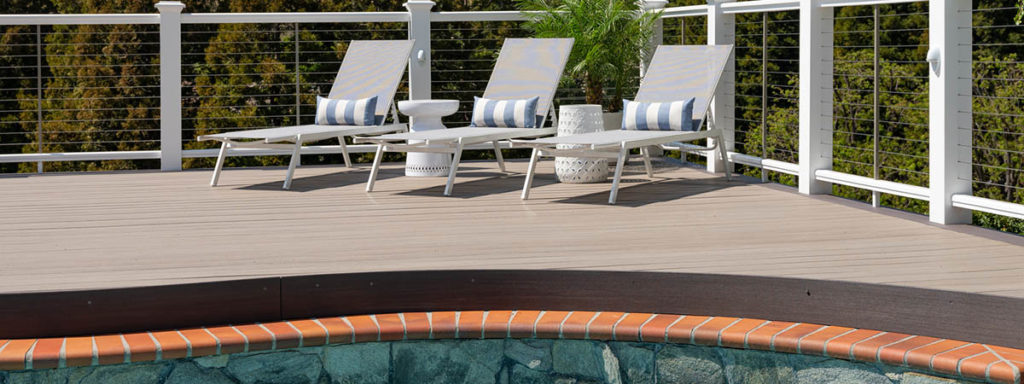 A composite pool deck made with Coastline gray capped polymer decking