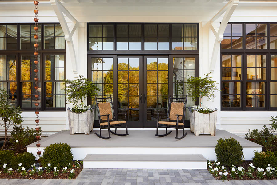 A small back porch built by deck contractors on a southern-style home