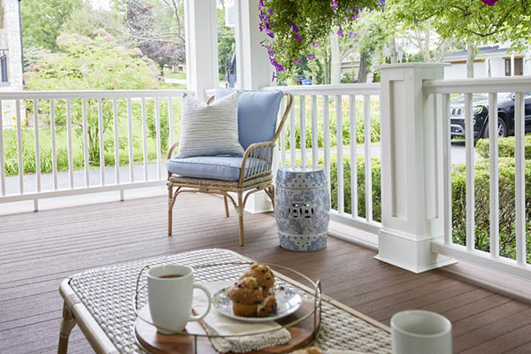 Front porch deck ideas include a traditional railing like white composite Premier Rail