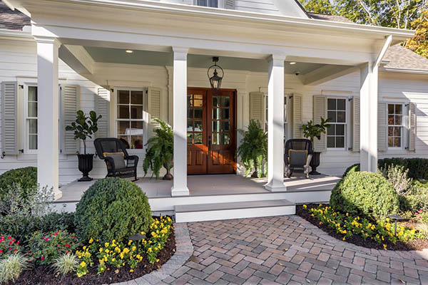 Front porch deck ideas include column wraps for a stately look