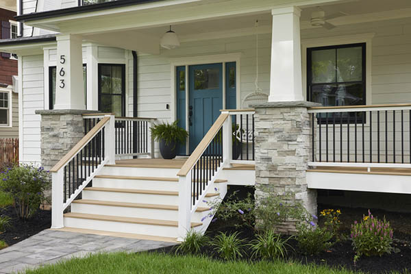 Front porch deck ideas include tapered column wraps for a unique, artisanal look