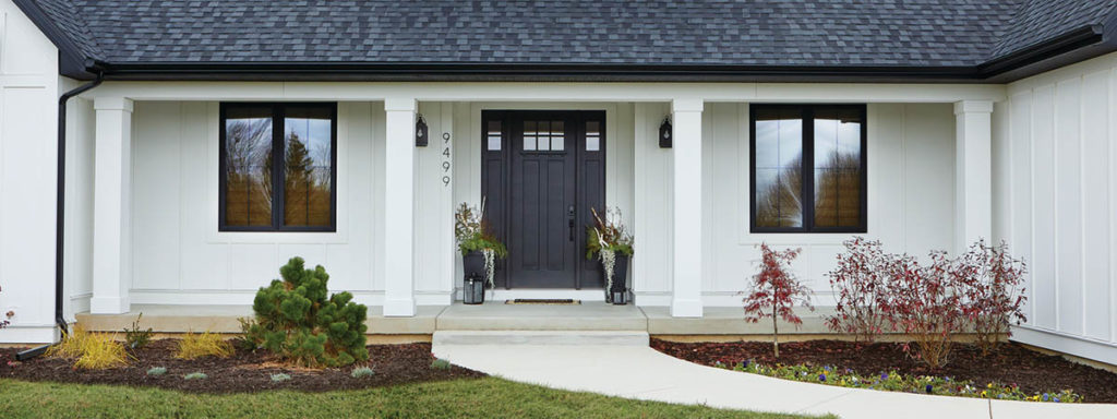 Modern farmhouse features modern front porch ideas like AZEK Exteriors trim