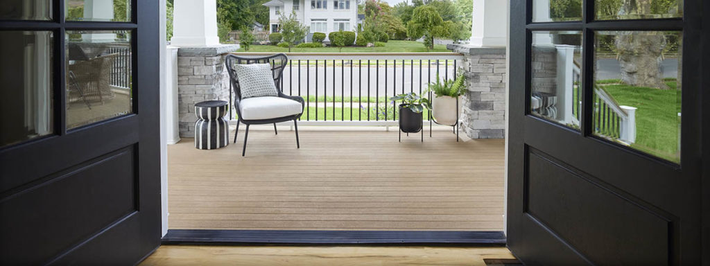 An inviting porch featuring modern front porch ideas like interior-inspired decor