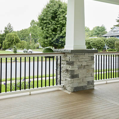 Modern front porch ideas include modern railing designs like the Drink Rail