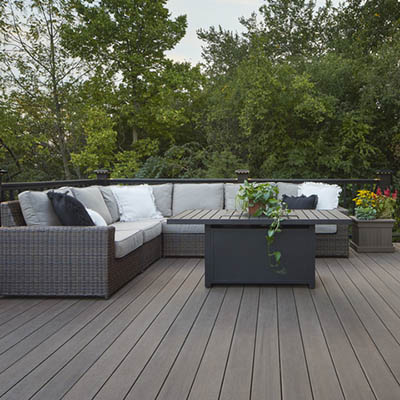 Simple backyard decks include an L-shaped couch in the deck corner