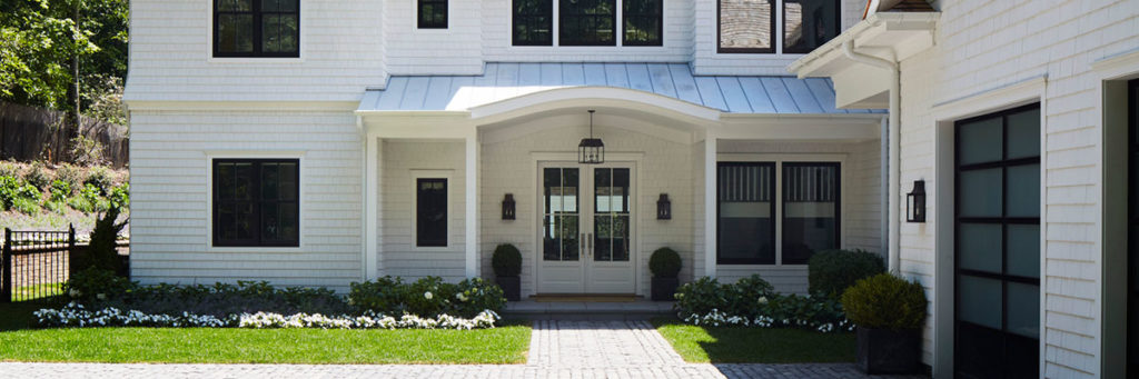 Front porch ideas like this white coastal style home by TimberTech