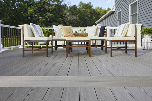Coastal style gray composite deck with AZEK cortex screws for a fastener-free surface