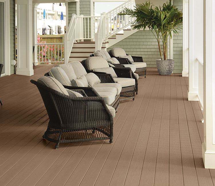 Row of chairs on Classic Brown decking on beachfront property