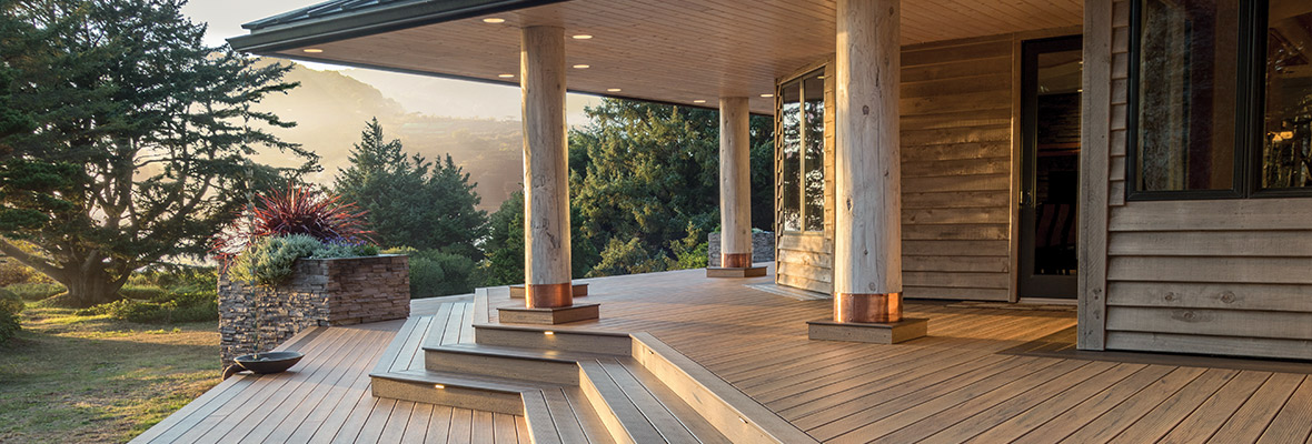 A freshly cleaned composite deck on a house overlooking the mountains.