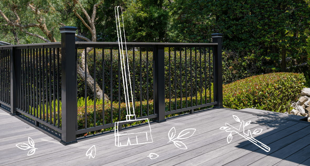 Gray deck with trees and greenery in the background that includes illustrations of leaves on the deck and a broom.