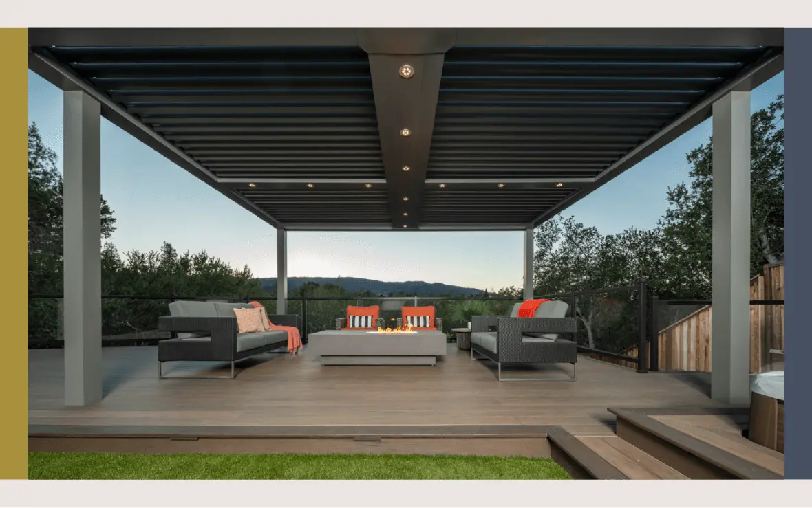 A small platform deck with furniture and a fire pit sits under a lighted pergola. 