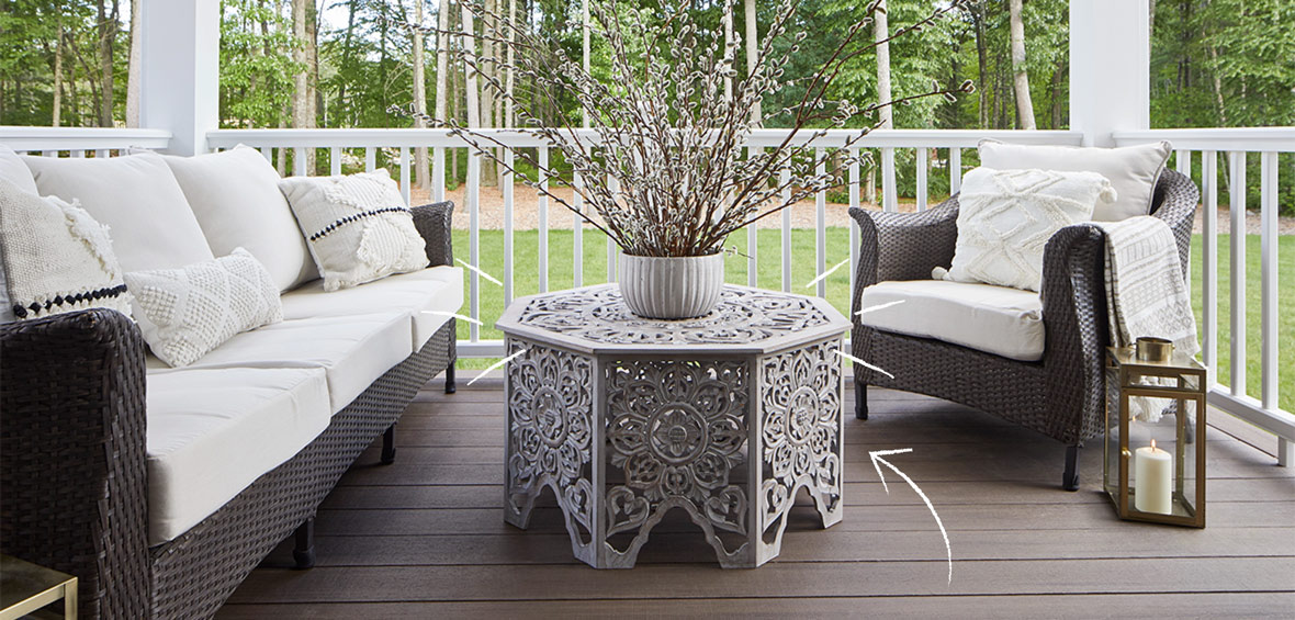 Intricate outdoor coffee table acts as a focal point in the center of outdoor seating.
