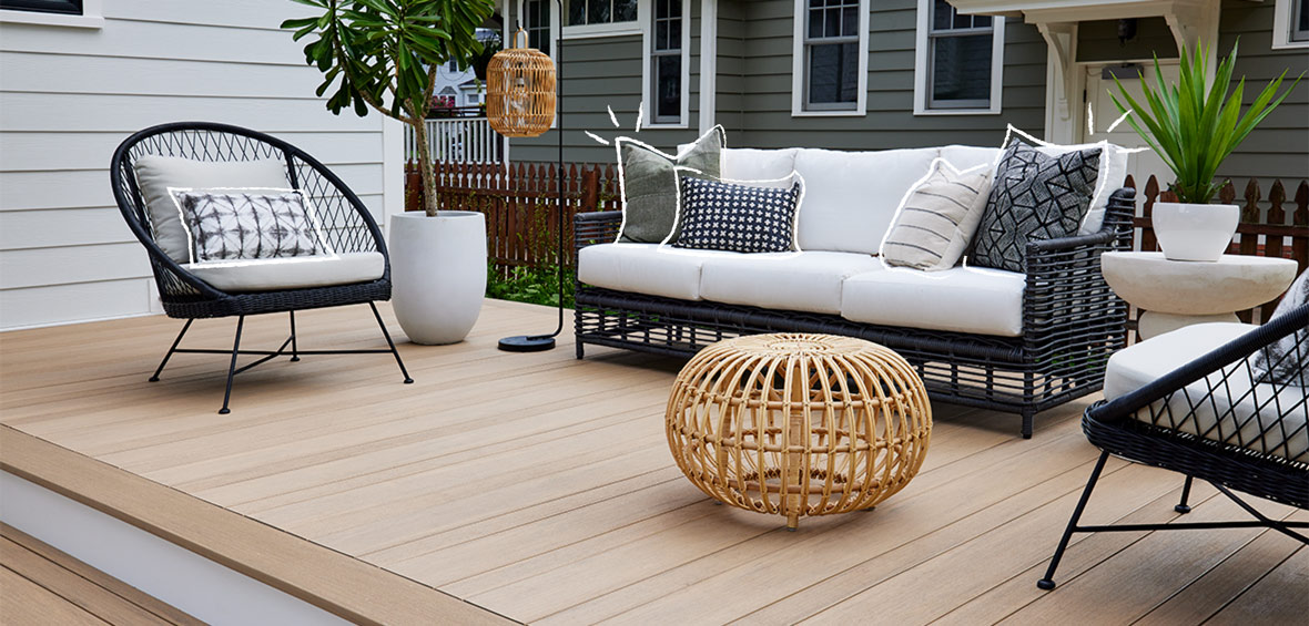 Black and white decorative pillows on outdoor furnishings.