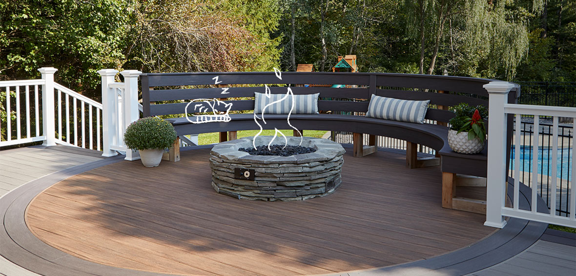 Black curved deck has a built-in bench along the perimeter in place of railings. 