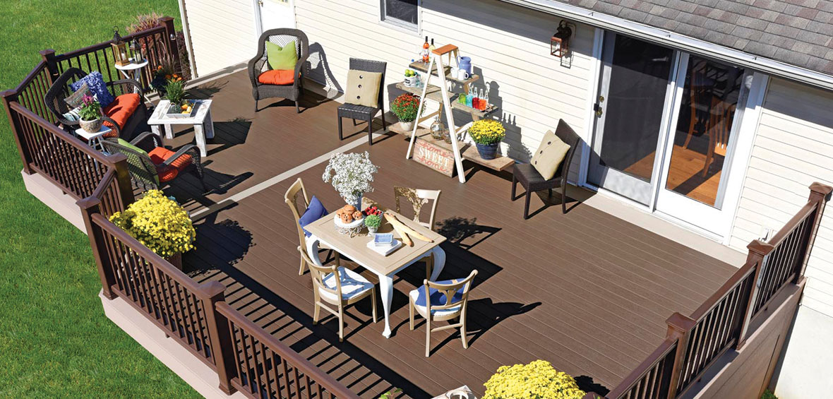 An overhead photo shows a seating area, dining set, and bar/planter combo coexisting on a small deck. 