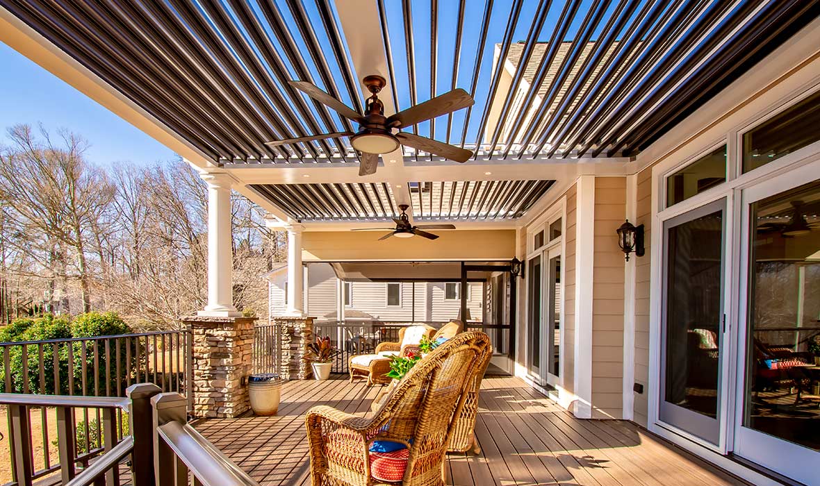 A custom overhang protects a deck and outdoor furniture from the sun.