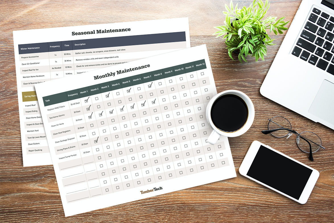 A mockup of a monthly and seasonal home maintenance checklist on a table next to a laptop and cup of coffee.