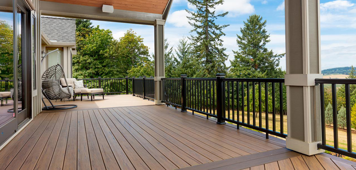A photo from an elevated deck shows a deck’s surface, including different color decking boards and creative patterns. 