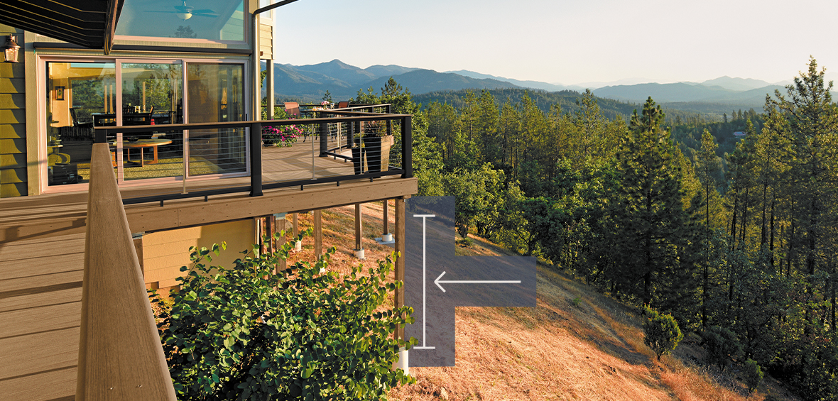 A stilted deck on a hill at sunrise includes an arrow indicating the deck’s support posts, which elevate the deck off of the ground.
