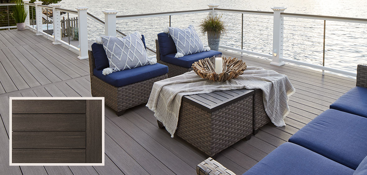 A lakeside PVC deck features blue outdoor furniture and light decor with a close-up image of the PVC decking in the lower-left corner. 