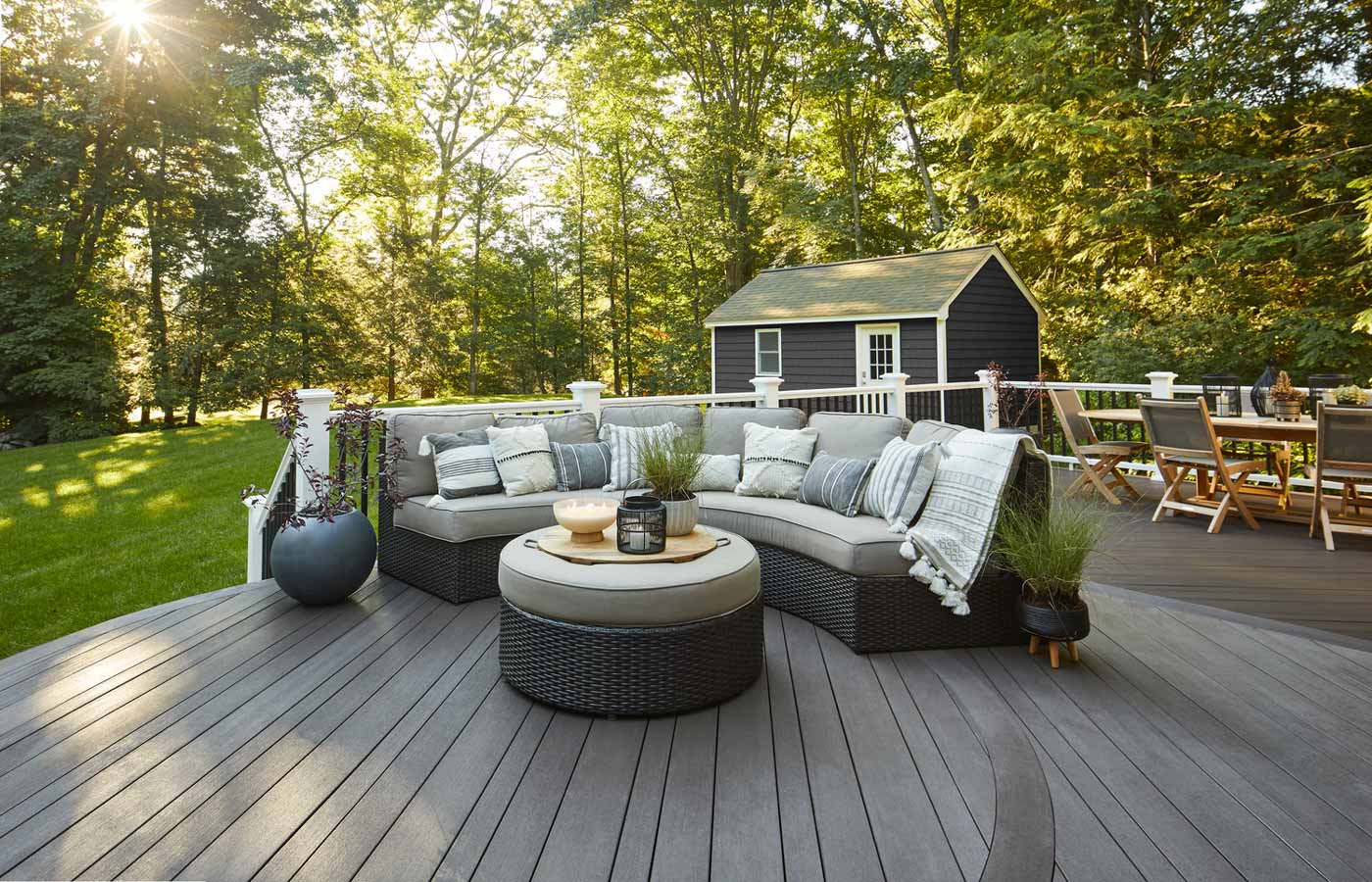 Composite deck with striking deck board pattern and patio furniture