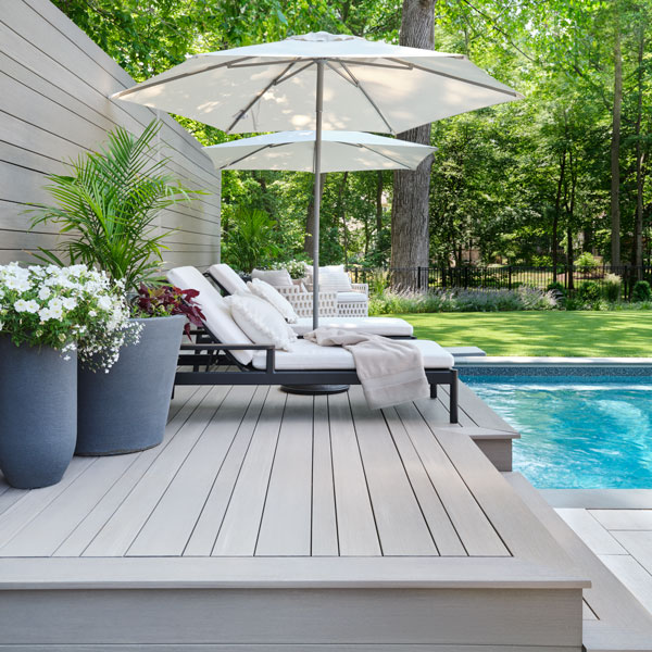 Coastline Multiwidth Decking from the Advanced PVC line next to an in-ground pool