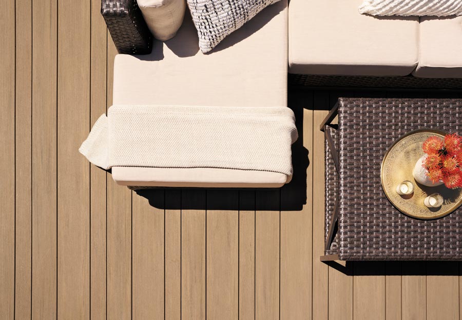 Overhead shot of the multiwidth Weathered Teak deck boards and outdoor furniture