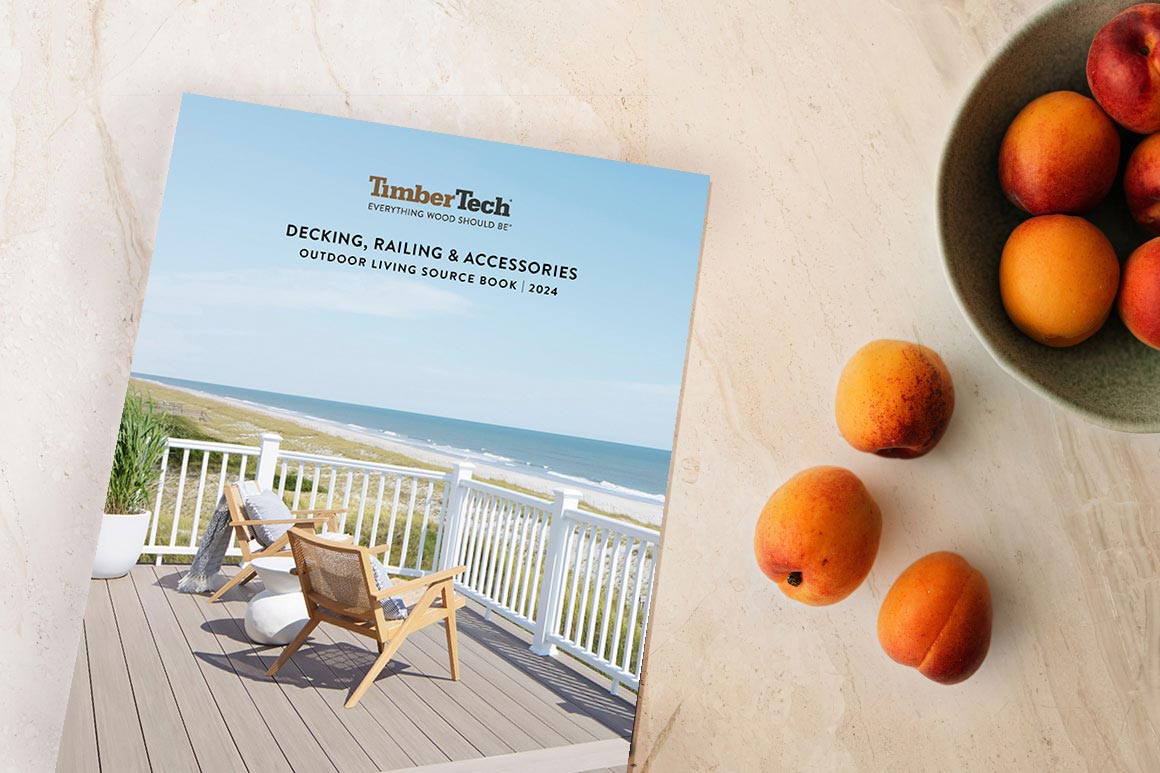 TimberTech Outdoor Living Source Book on countertop next to bowl of peaches