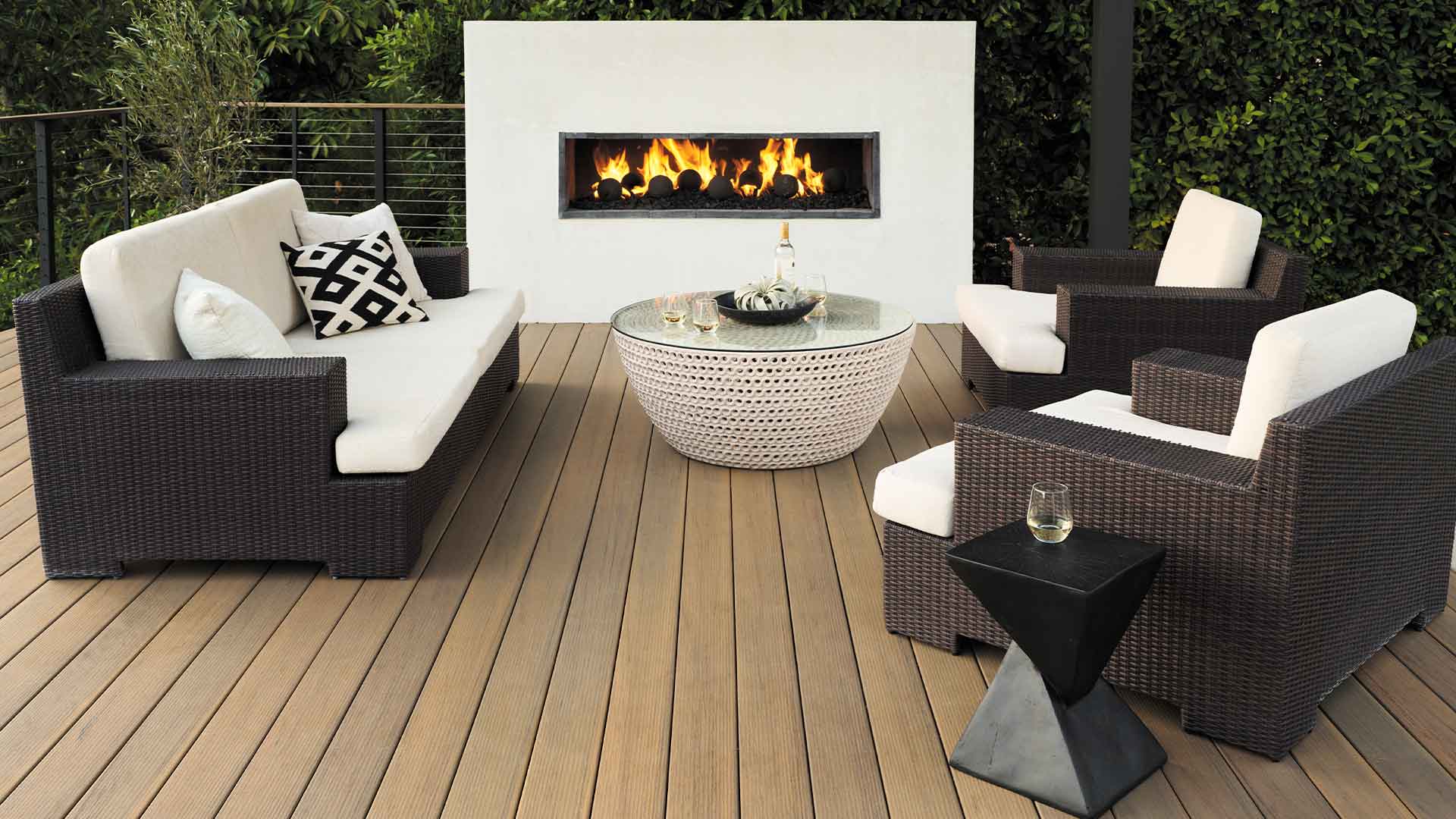 Brown deck with high color variation and outdoor fireplace
