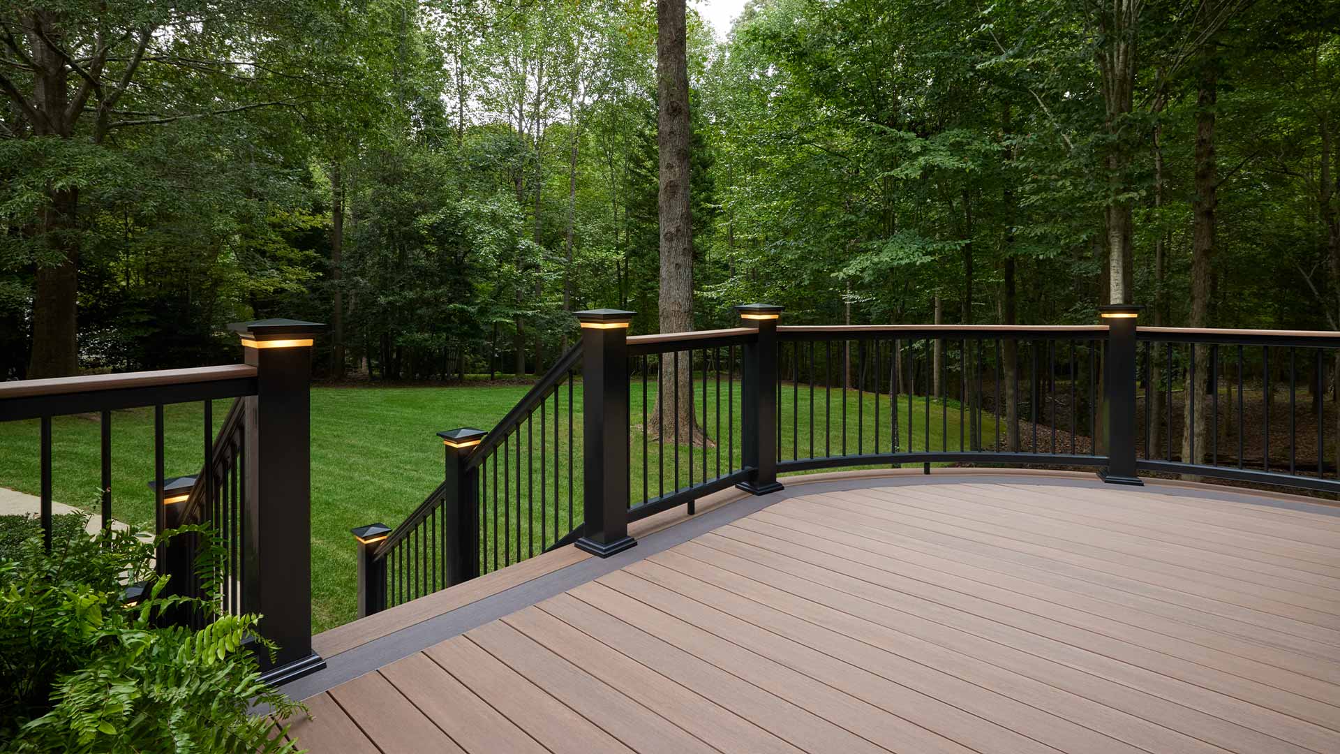 Curved brown deck with picture framed multi color boards