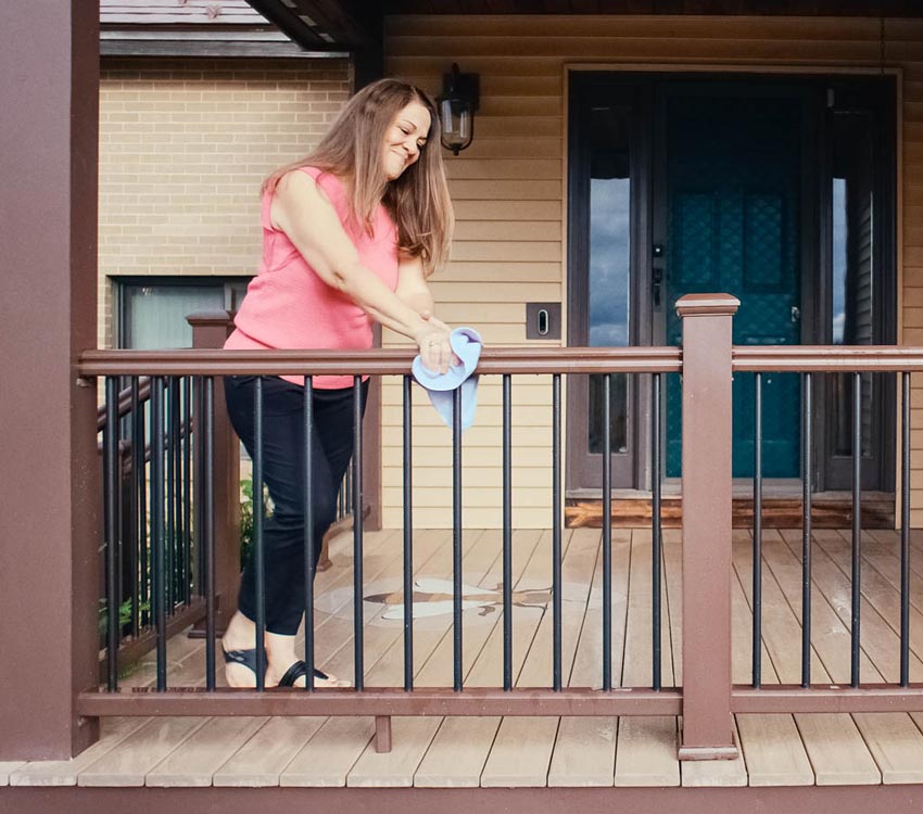 Lori wipes down her RadianceRail Express railing in Kona with a wash cloth