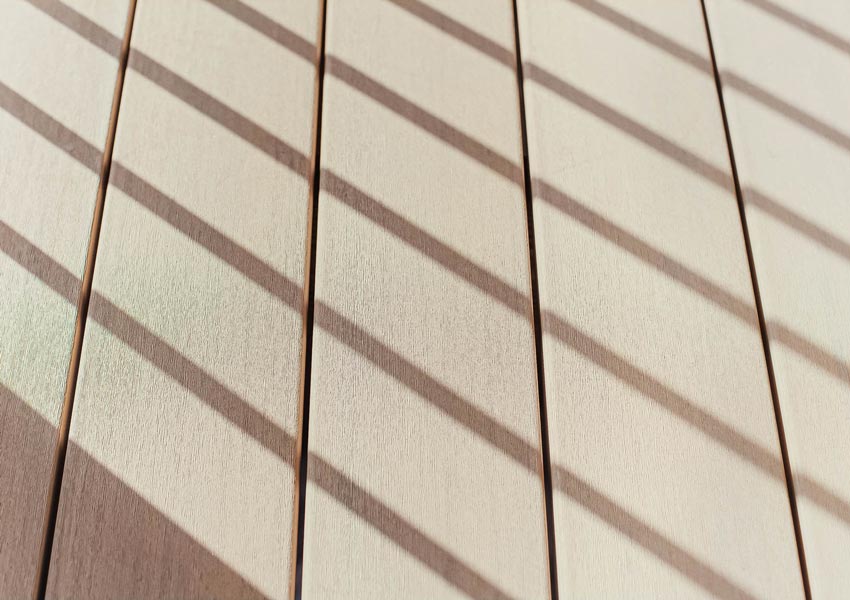 Up close detail shot of TimberTech Advanced PVC French White Oak deck boards from the Landmark Collection