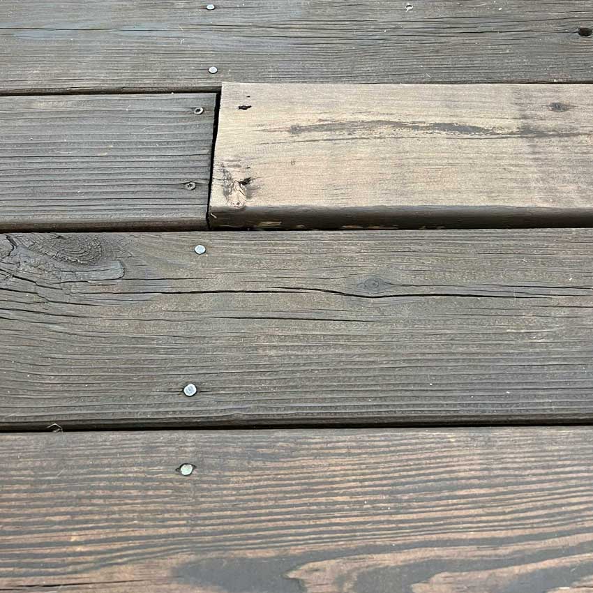 Rotting and discolored deck boards