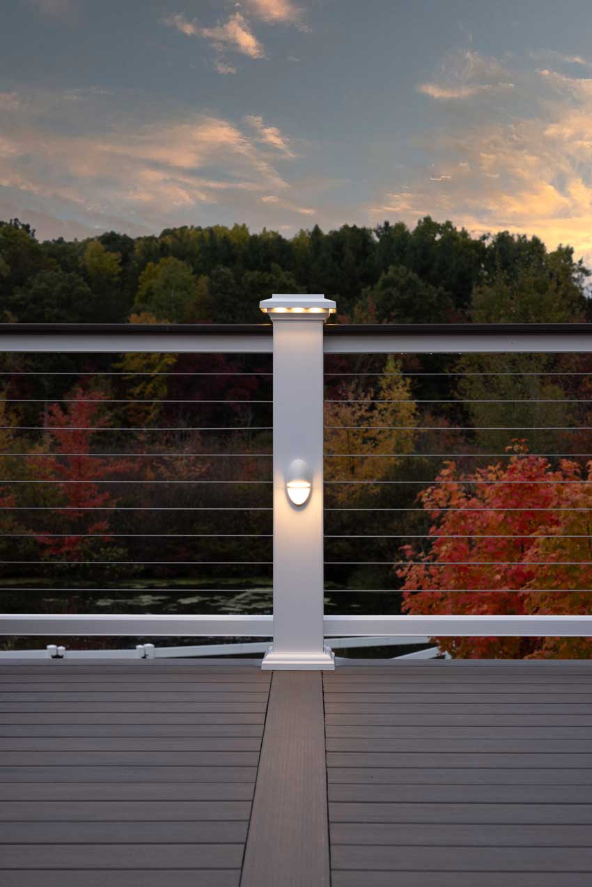 Built in railing lighting softly glows at dusk