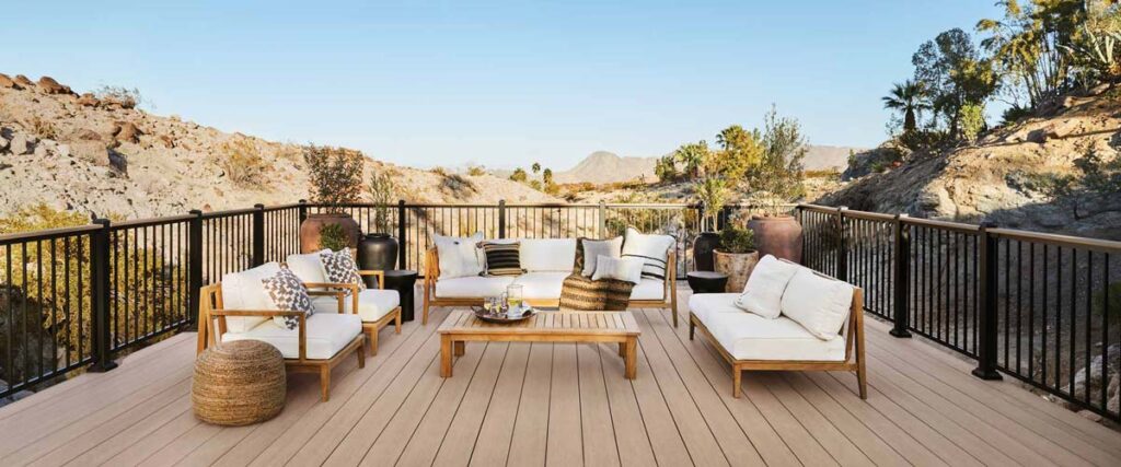 Outdoor living room on a light brown deck in the desert