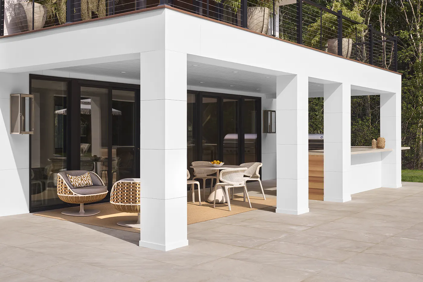 Large, squared-off pillars underneath the second story deck create an enclosed space underneath the deck.