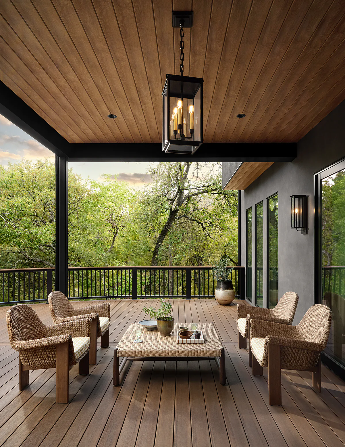 The ceiling of the first story deck is visible with hanging lanterns prominently positioned to light the deck at night