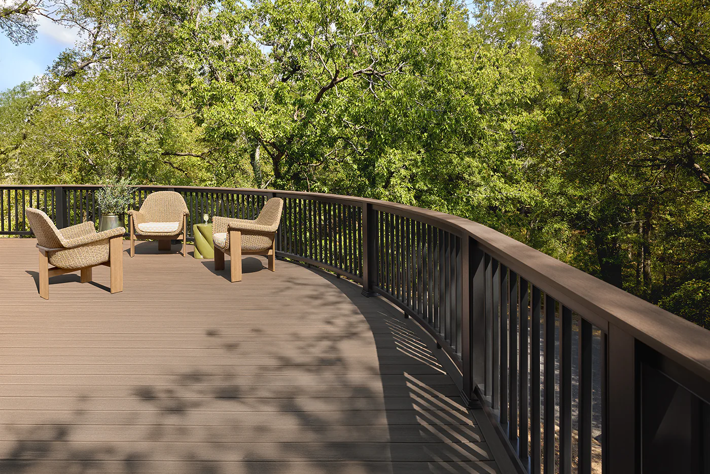 Photo showing the gentle curve of the first story of the deck and railing