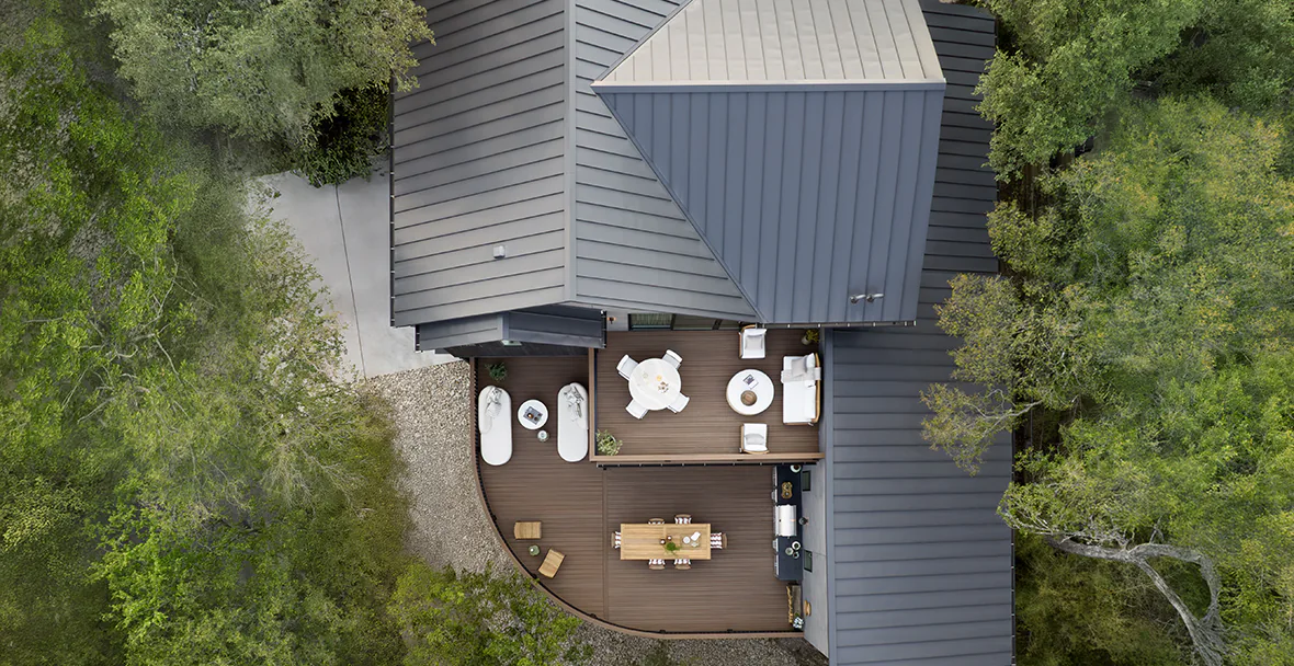 Drone shot displays the massive amount of floor space added to the house as a result of the deck build